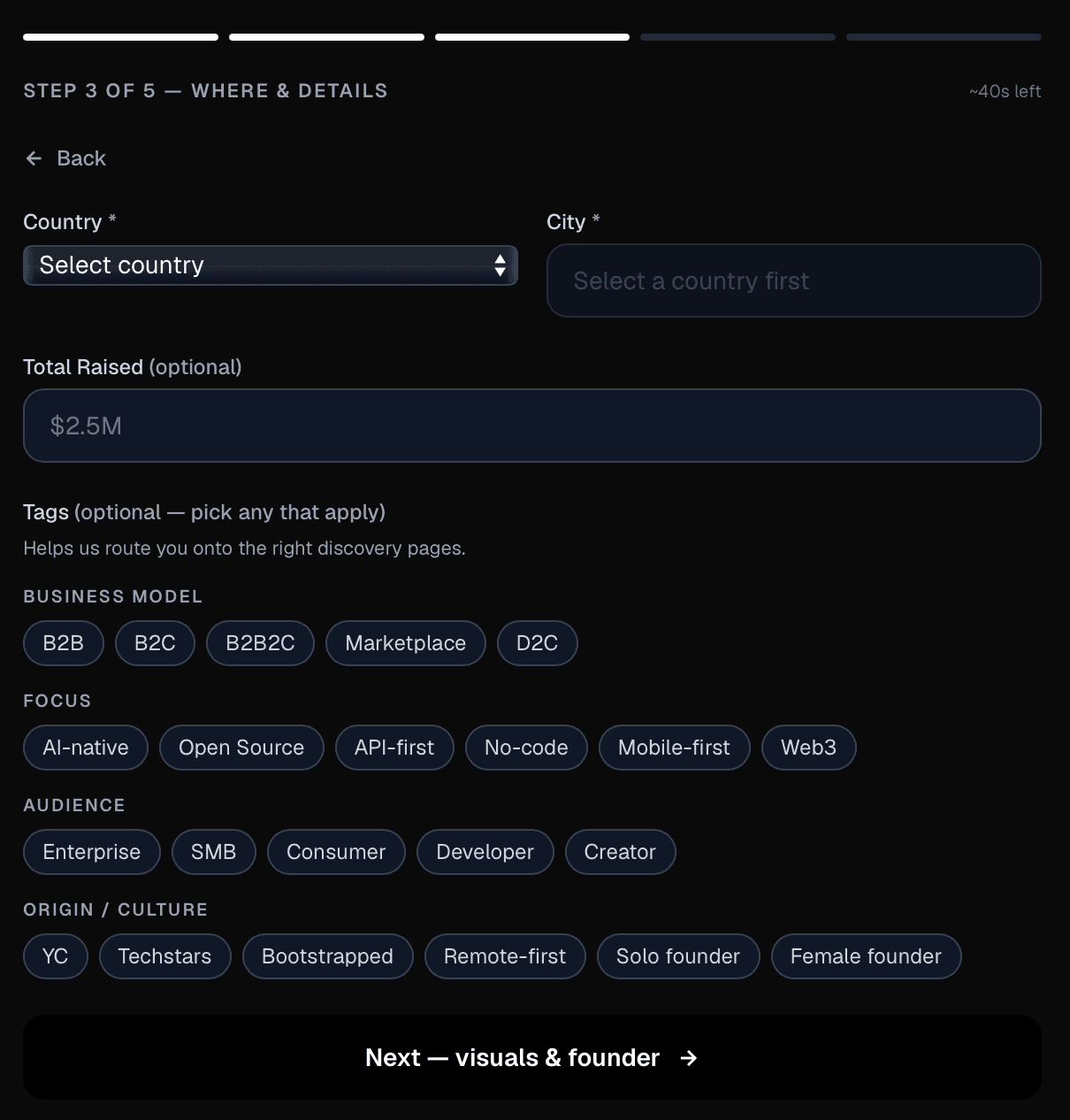Startups.fm submit form step 3: country, city, optional total raised, and discovery tags like B2B, AI-native, or Bootstrapped